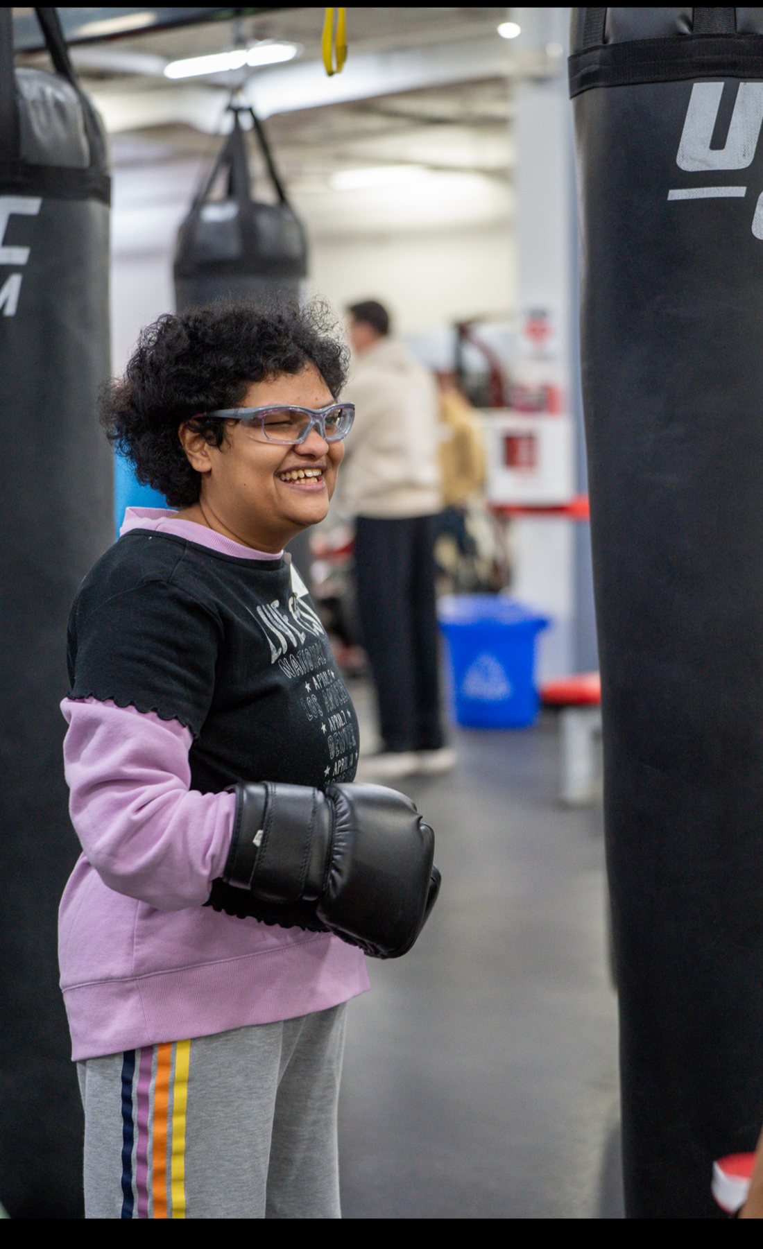 A Be Yourself Group member boxing at UFC Gym of Naperville