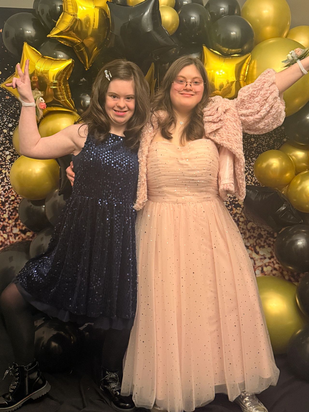 Two Be Yourself Group members dressed up and celebrating together